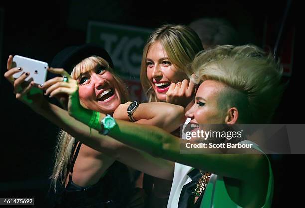 Maria Sharapova poses for a selfie with Miriam Nervo and Olivia Nervo of NERVO as they DJ at the TAG Heuer Party at Ms Collins on January 13, 2015 in...
