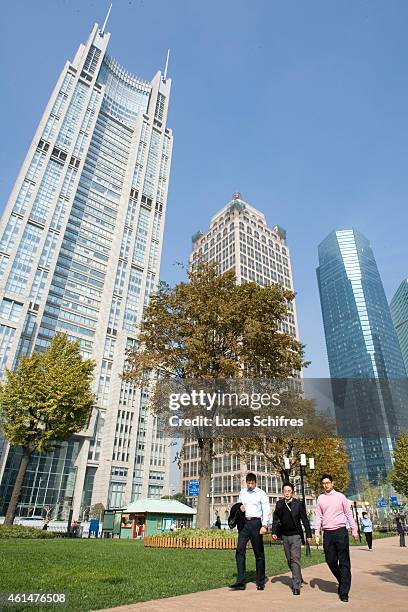 November 24: Employees walk in Luziajui business district during their lunch break on November 24, 2009 in Shanghai, China.