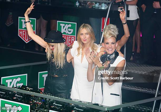 Maria Sharapova helps as Miriam Nervo and Olivia Nervo of NERVO DJ as they attend the TAG Heuer Party at Ms Collins on January 13, 2015 in Melbourne,...