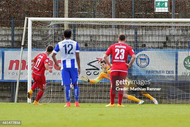 Akaki Gogia of Hallescher FC scores a goal to make it 0:1 against Rune Almenning Jarstein of Hertha BSC during a Friendly Match between Hertha BSC...
