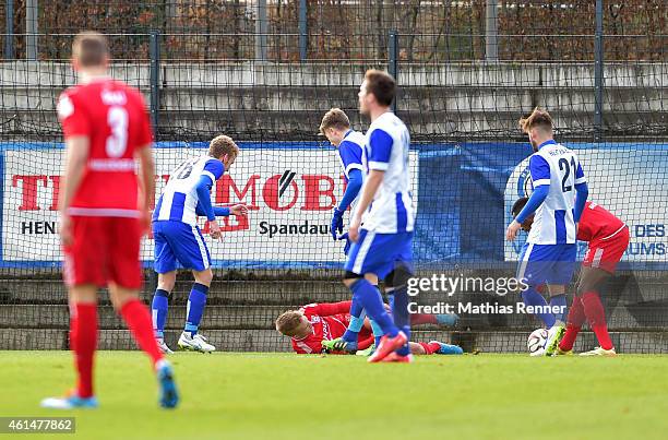 Fabian Lustenberger, Jens Hegeler of Hertha BSC and Maximilian Jansen of Hallescher FC argue during a Friendly Match between Hertha BSC and...