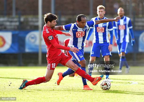 Tim Kruse of Hallescher FC and Ronny of Hertha BSC fight for the ball during a Friendly Match between Hertha BSC and Hallescher FC on January 13,...