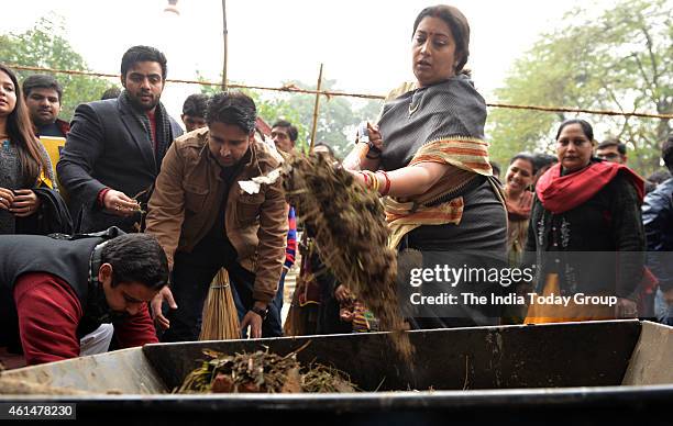 Minister Smriti Zubin Irani with DUSU Student Union Organization Cleanliness Drive at Sanjay Basti in New Delhi.