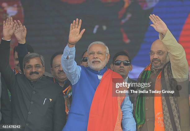 Prime Minister Narendra Modi,Amit Shah and Satish Upadhyay during the BJP's 'Abhinandan' rally in New Delhi.