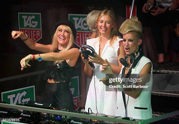 Maria Sharapova helps as Miriam Nervo and Olivia Nervo of NERVO DJ as they attend the TAG Heuer Party at Ms Collins on January 13, 2015 in Melbourne,...