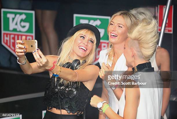 Maria Sharapova poses for a selfie with Miriam Nervo and Olivia Nervo of NERVO as they DJ at the TAG Heuer Party at Ms Collins on January 13, 2015 in...