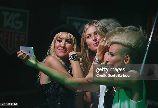 Maria Sharapova poses for a selfie with Miriam Nervo and Olivia Nervo of NERVO as they DJ at the TAG Heuer Party at Ms Collins on January 13, 2015 in...