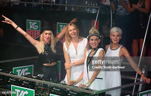 Maria Sharapova helps as Miriam Nervo and Olivia Nervo of NERVO DJ along with Kate Peck as they attend the TAG Heuer Party at Ms Collins on January...