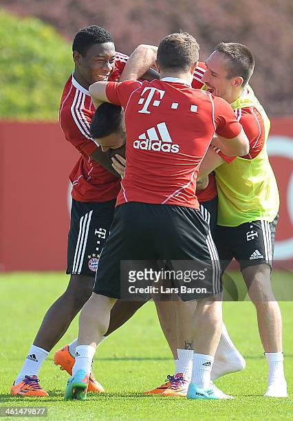 Franck Ribery jokes with David Alaba, Diego Contento and Mitchell Weiser during a training session at day 5 of the Bayern Muenchen training camp at...