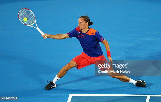 Alexandr Dolgopolov of the Ukraine plays a forehand in his match against Bernard Tomic of Australia during day five of the 2014 Sydney International...