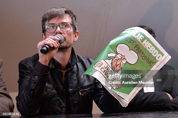 Charlie Hebdo cartoonist, Renald Luzier aka Luz, speaks during a Charlie Hebdo press conference held at the Liberation offices in Paris on January...