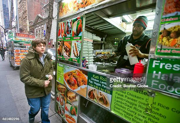 Sam Sevian, of Southbridge, Mass., the youngest-ever American born grandmaster, grabs a quick lunch from a NYC food truck during his "Young Stars -...