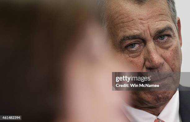 Speaker of the House John Boehner listens as members of the House Republican leadership speak at a press conference at the U.S Capitol on January 13,...