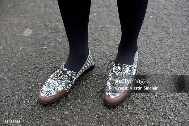 Fashion Editor for Elle China wearing Maiyet shoes on day 4 of London Collections: Men on January 12, 2015 in London, England.