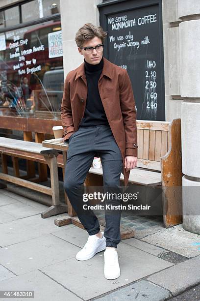 Model Oliver Cheshire wearing Nike Air Force One trainers, Top Man Trousers, Marks and Spencers jumper, aquascutum jacket, Vintage glasses on day 4...