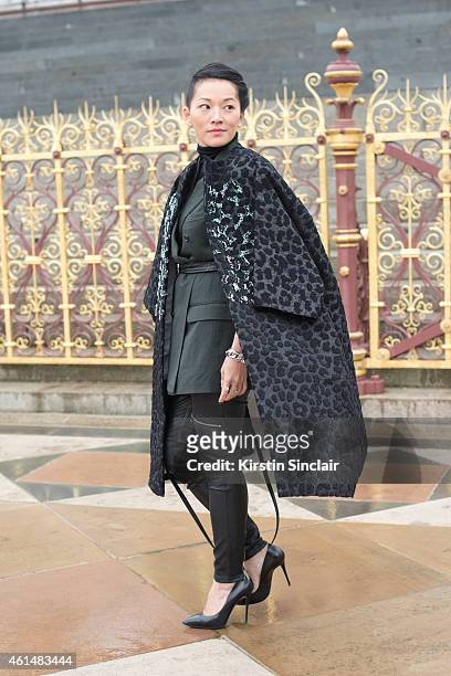 Stylist Tina Leung wearing a Louis Vuitton bag, Giuseppe Zanotti shoes, Dior jacket, Dunhill Blazer and Maje trousers on day 4 of London Collections:...