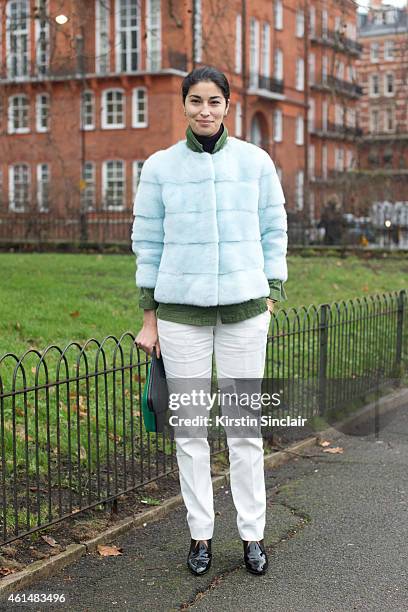 Caroline Issa wearing Lily E Violetta fur jacket, Marc by Marc jacket, Jason Wu trousers and Louis Vuitton boots on day 4 of London Collections: Men...