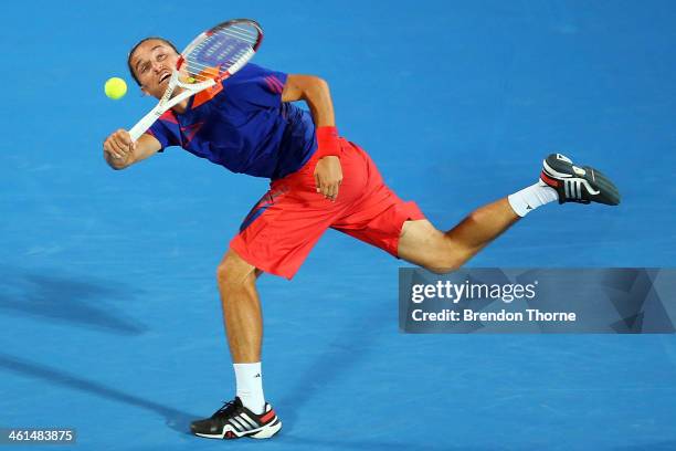 Alexandr Dolgopolov of the Ukraine receives serve in his quarter final match against Bernard Tomic of Australia during day five of the 2014 Sydney...