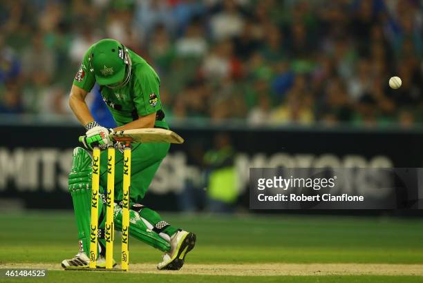 Luke Wright of the Stars is struck by a rising delivery from Shaun Tait of the Strikers during the Big Bash League match between the Melbourne Stars...