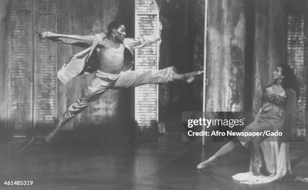 Shirtless Lowell Smith performs a flying leap during a performance of A Streetcar Named Desire at Harlem Dance Theatre, New York, New York, 1965.