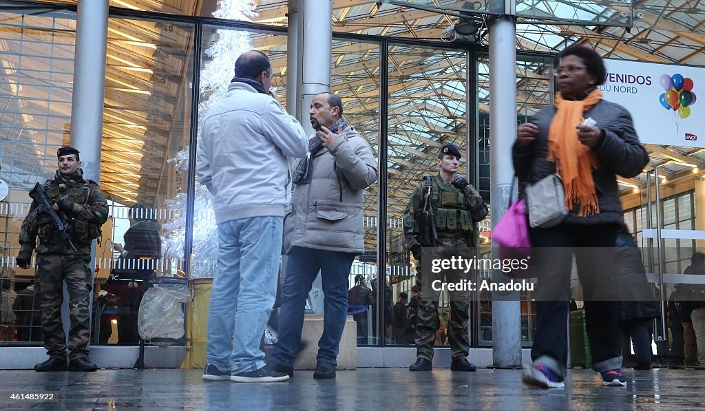 French armed soldiers patrol at the Gare du Nord