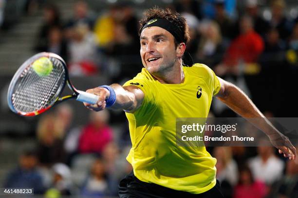 Marinko Matosevic of Australia plays a backhand in his quarter final match against Sergiy Stakhovsky of the Ukraine during day five of the 2014...