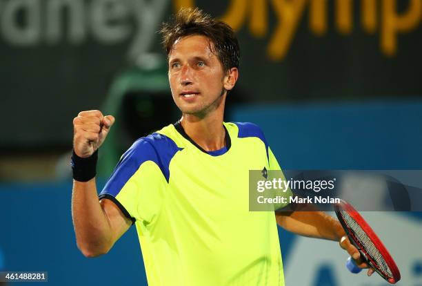 Sergiy Stakhovsky of the Ukraine celebrates winning his match against Marinko Matosevic of Australia during day five of the 2014 Sydney International...