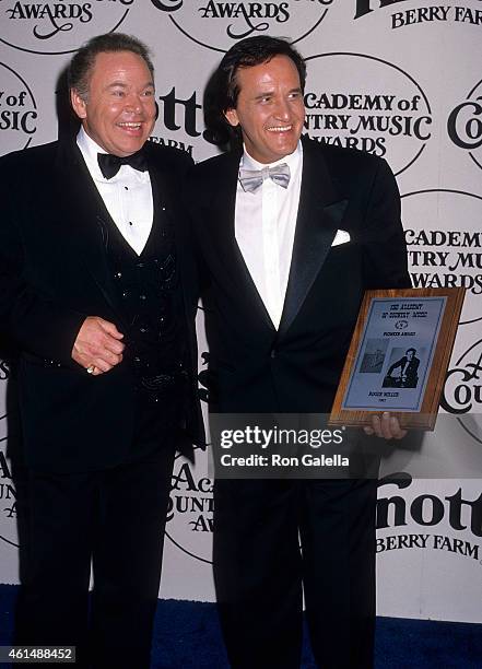 Musician Roy Clark and musician Roger Miller attend the 23rd Annual Academy of Country Music Awards on March 21, 1988 at the Good Time Theatre,...