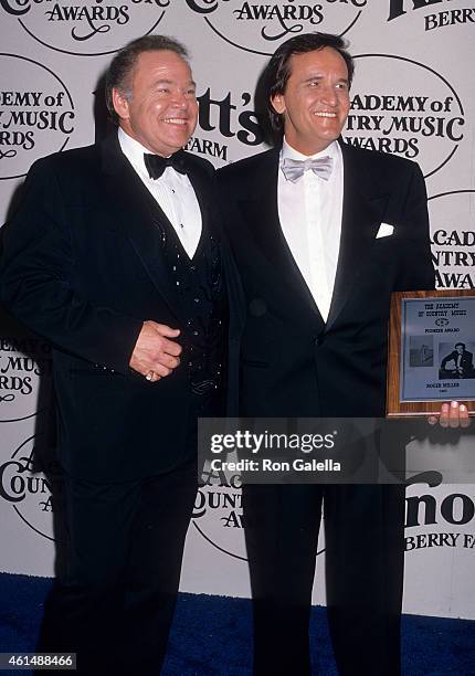 Musician Roy Clark and musician Roger Miller attend the 23rd Annual Academy of Country Music Awards on March 21, 1988 at the Good Time Theatre,...