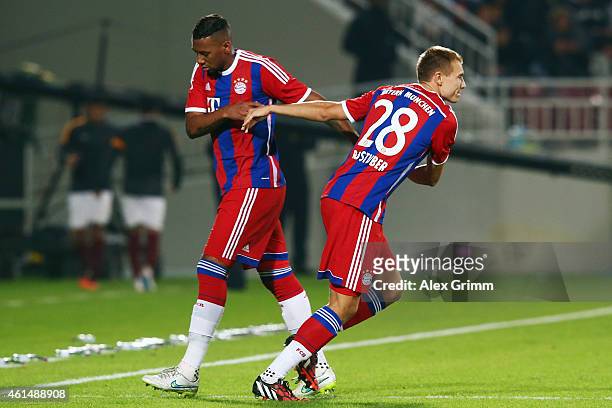 Jerome Boateng of Muenchen is replaced by Holger Badstuber during a friendly match between FC Bayern Muenchen and Qatar Stars at Abdullah bin Khalifa...