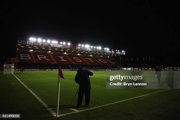 Groundsmen prepare the pitch ahead of the FA Cup Third Round Replay between Bristol City and Doncaster Rovers at Ashton Gate on January 13, 2015 in...