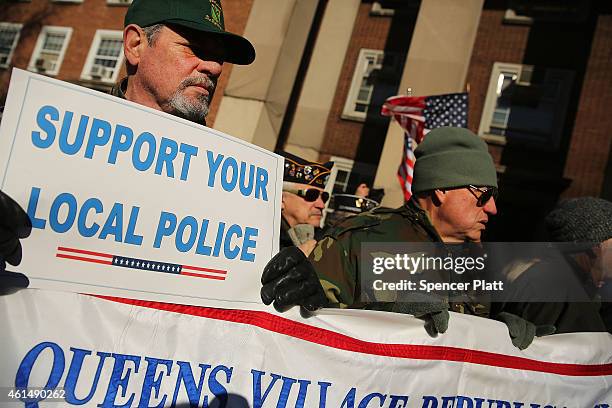 Supporters of the New York Police Department attend a "Support Your Local Police" news conference and rally at Queens Borough Hall on January 13,...