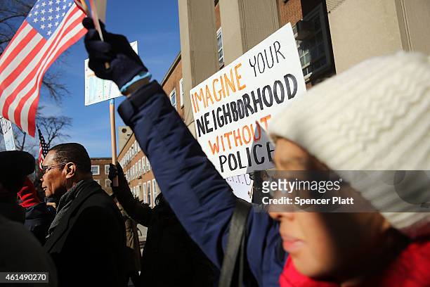Supporters of the New York Police Department attend a "Support Your Local Police" news conference and rally at Queens Borough Hall on January 13,...