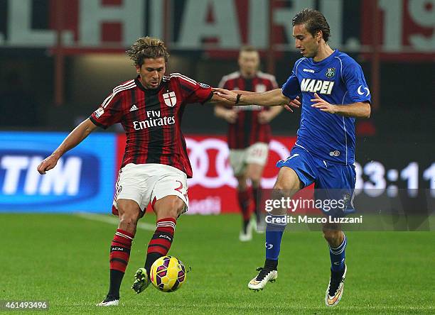 Alessio Cerci of AC Milan competes for the ball with Simone Missiroli of US Sassuolo Calcio during the TIM Cup match between AC Milan and US Sassuolo...