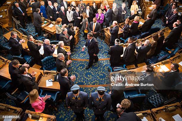 New Jersey Governor Chris Christie shakes hands with audience members after the annual State of the State address on January 13, 2015 in Trenton, New...