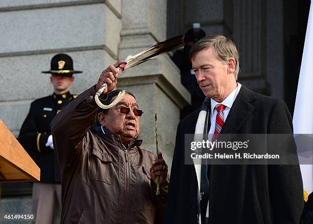 Governor John Hickenlooper gets a native american blessing from Terry Knight of the Ute Mountain Tribe during his inauguration ceremony at the state...