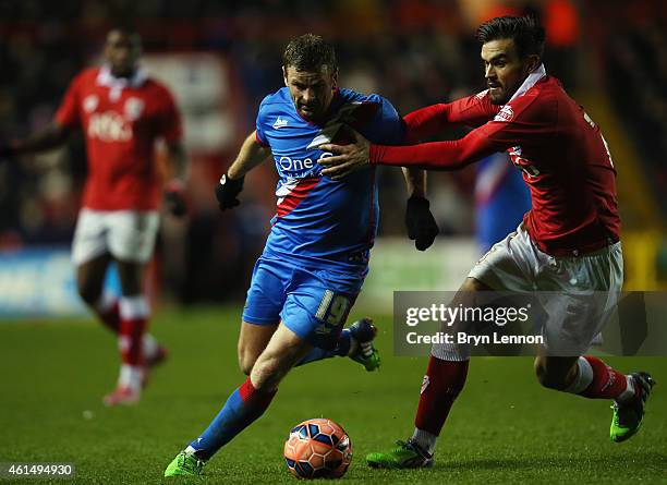 Marlon Pack of Bristol City holds back Richie Wellens of Doncaster Rovers during the FA Cup Third Round Replay between Bristol City and Doncaster...