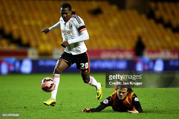 Hugo Rodallega of Fulham runs with the ball past Richard Stearman of Wolves during the FA Cup third round replay match between Wolverhampton...
