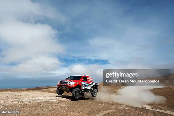 Giniel De Villiers of South Africa and Dirk Von Zitzewitz of Germany for Toyota Imperial Team South Africa in the Pick Up Hilux compete in the...