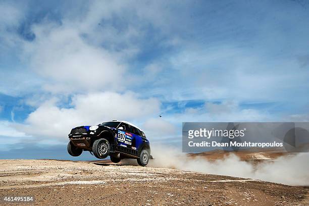 Krzysztof Holowczyc of Poland and Xavier Panseri of France driving for the ALL4 Racing Mini Monster Energy Rally Raid Team compete in the Atacama...
