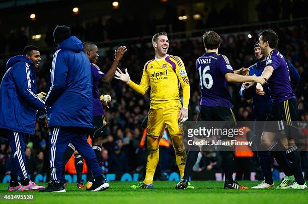 Adrian of West Ham United celebrates with team mates as he scores the winning penalty in the shoot out during the FA Cup Third Round Replay match...