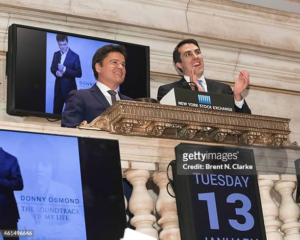 Entertainer Donny Osmond rings the NYSE closing bell to celebrate the release of his 60th album at the New York Stock Exchange on January 13, 2015 in...