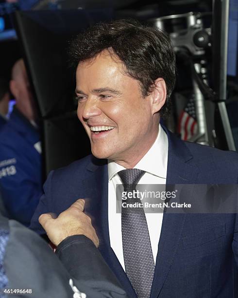Entertainer Donny Osmond appears on the trading floor prior to ringing the NYSE closing bell to celebrate the release of his 60th album at the New...