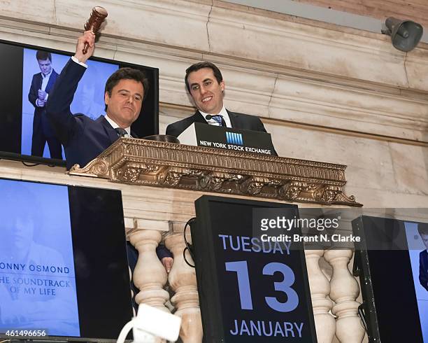 Entertainer Donny Osmond rings the NYSE closing bell to celebrate the release of his 60th album at the New York Stock Exchange on January 13, 2015 in...