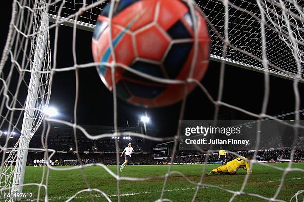 Phil Jagielka of Everton scores in the penalty shoot out as Adrian of West Ham dives the wrong way during the FA Cup Third Round Replay match between...