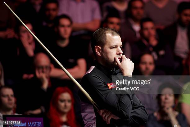 Barry S. Hawkins of UK eyes the ball against Ali Carter of UK during day three of the 2015 Dafabet Masters at Alexandra Palace on January 13, 2015 in...