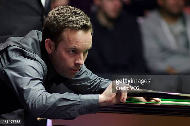 Ali Carter of UK plays a shot against Barry S. Hawkins of UK during day three of the 2015 Dafabet Masters at Alexandra Palace on January 13, 2015 in...