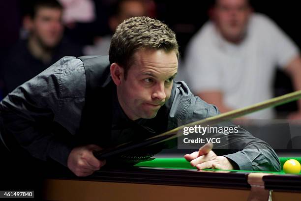 Ali Carter of UK plays a shot against Barry S. Hawkins of UK during day three of the 2015 Dafabet Masters at Alexandra Palace on January 13, 2015 in...