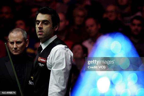 Ronnie O'Sullivan of UK eyes the ball against Ricky Walden of UK during day three of the 2015 Dafabet Masters at Alexandra Palace on January 13, 2015...