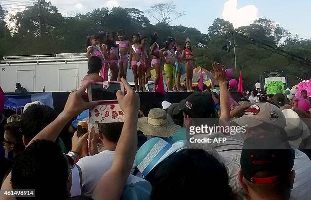Picture taken on January 11 of young girls competing on a contest wearing bikinis as part of the annual Festival del Rio Suarez on Barbosa, in...